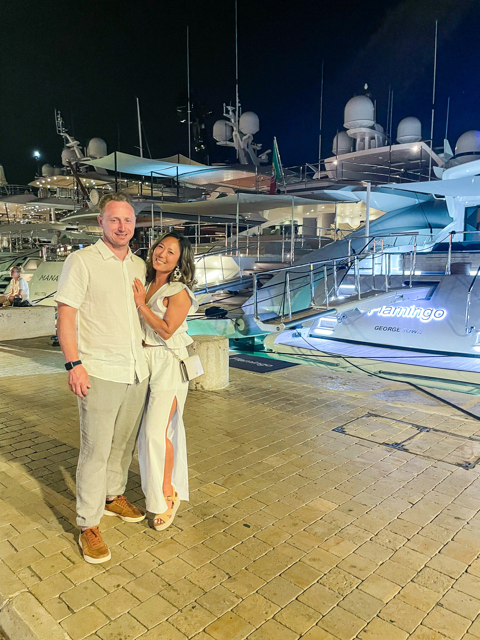 Erika & Mark standing in front of mega yachts in St. Tropez