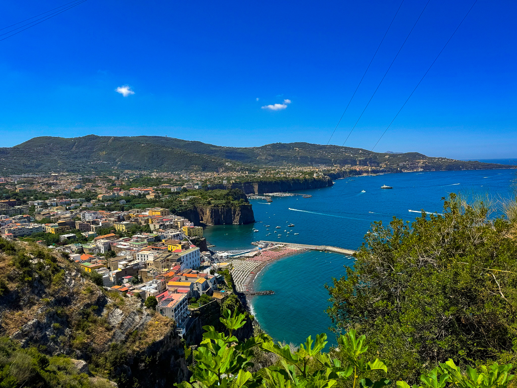View of Sorrento while driving in - aqua water, beach club, seeing the town